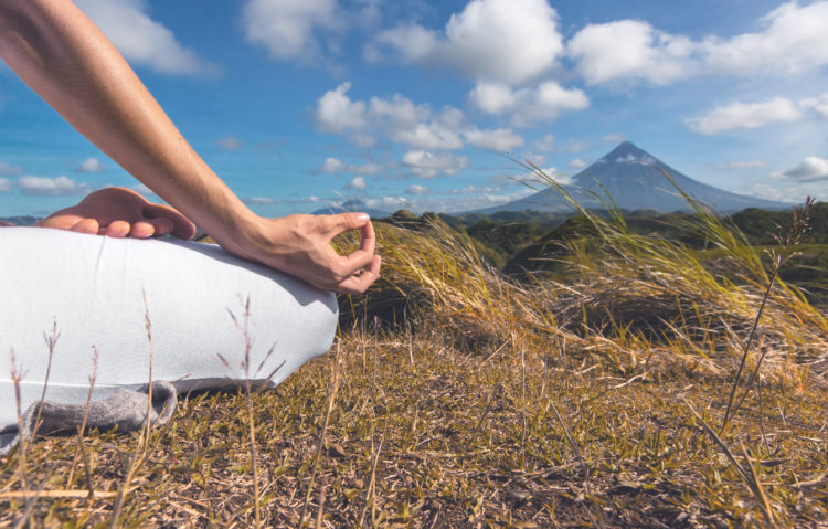 Banner: mindfulness in field across from mountain