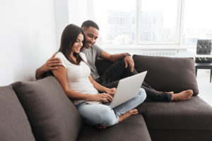 Couple getting online counseling via their laptop